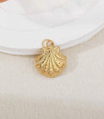 Gold shell charm